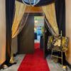 A red carpet is in the middle of a doorway.