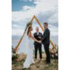 A couple getting married in front of an ocean view.