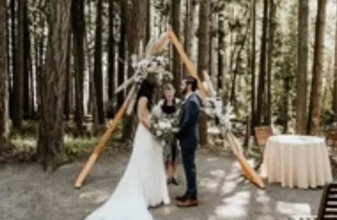 A couple getting married in the woods