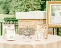 A table with pictures on it and a picture frame