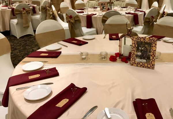 A table set up with plates and silverware.