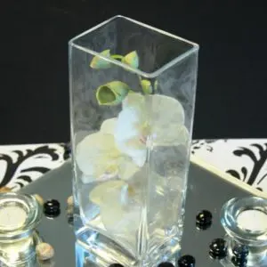 A vase with flowers on top of a table.