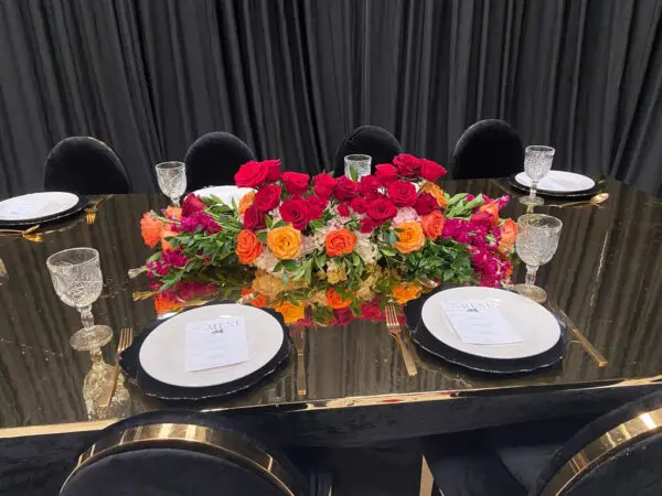 A table with plates and flowers on it