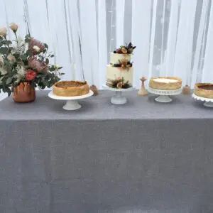 A table with several different cakes on it