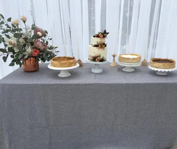 A table with several different cakes on it