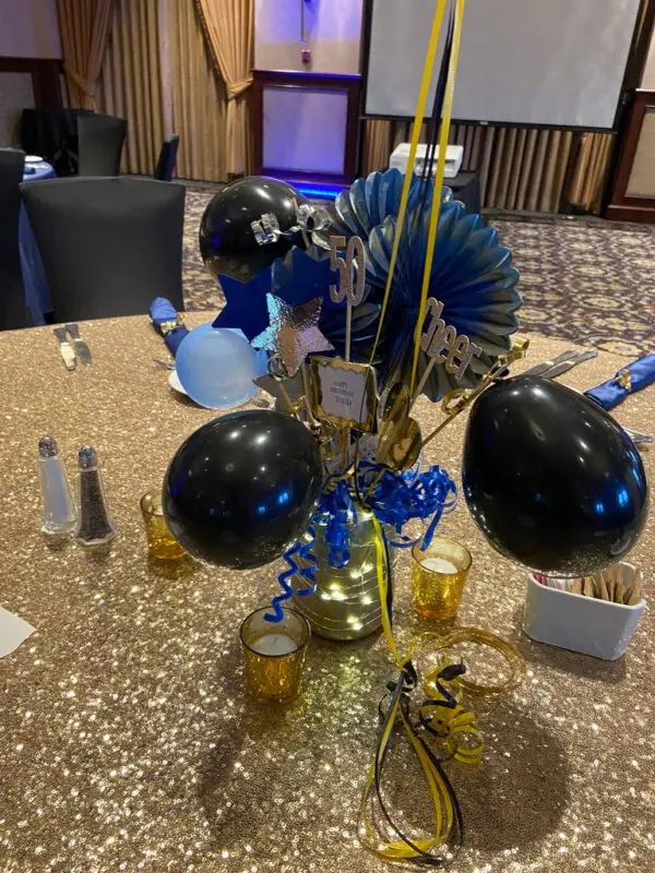 A table with balloons and decorations on it