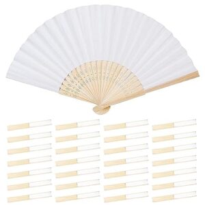 A white fan and some wooden sticks