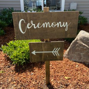 A ceremony sign in the middle of some bushes