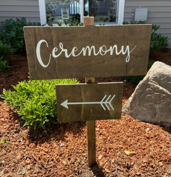 A ceremony sign in the middle of some bushes