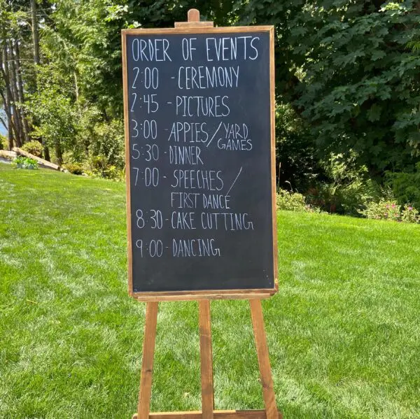 A sign with the time of an event written on it.