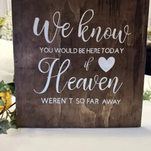 A sign that says we know you would be here today if heaven weren 't so far away.