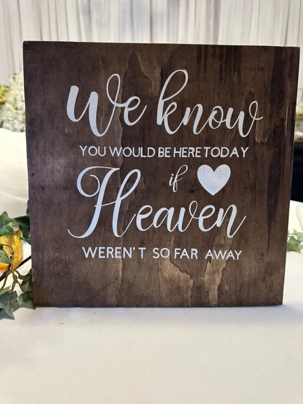 A sign that says we know you would be here today if heaven weren 't so far away.