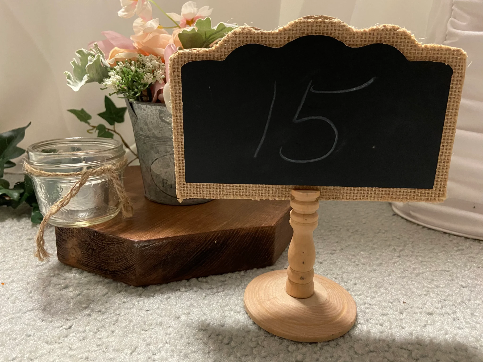 A chalkboard sign sitting on top of a table.