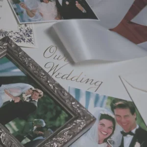 A picture of some wedding photos on top of the table.