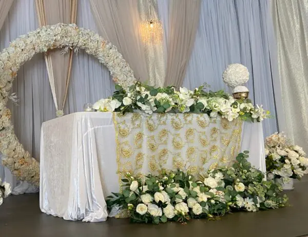 A table with flowers and candles on it