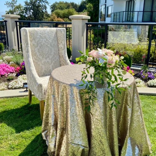 A table and chair set up in the grass.