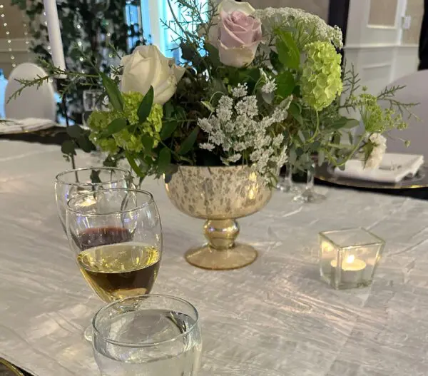 A table with flowers and candles on it