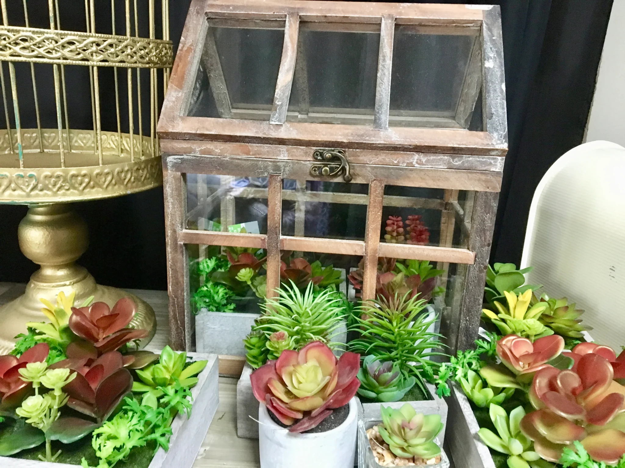 A wooden box with plants in it