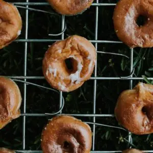 A close up of donuts on a rack