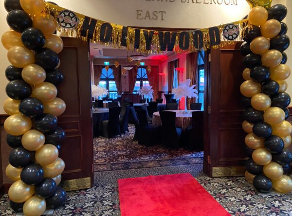 A red carpet and entrance to an event.