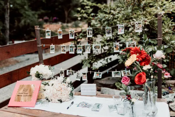 A table with flowers and pictures on it