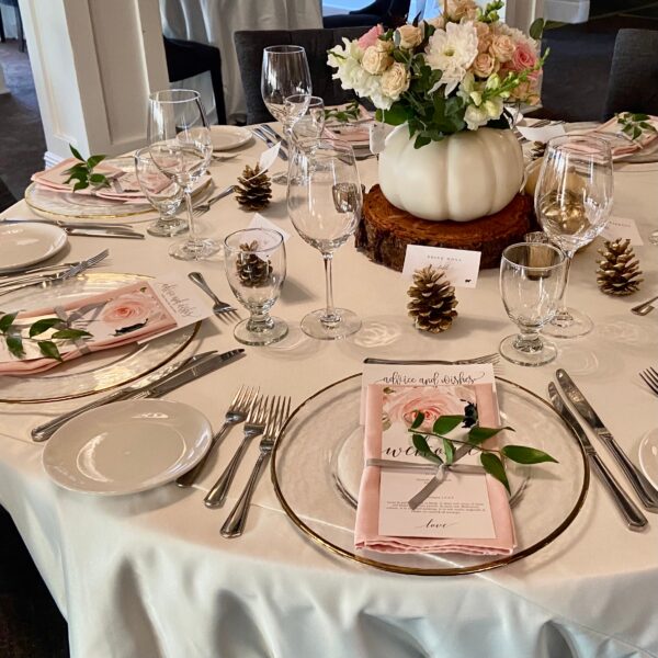 A table set with plates and silverware on top of it.