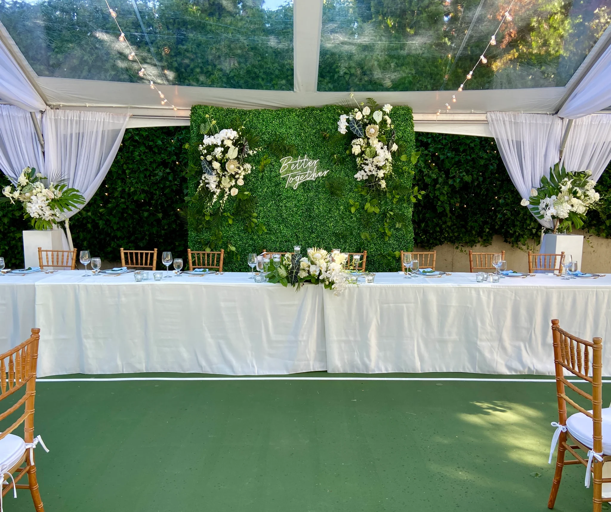 A table with flowers and a white tablecloth