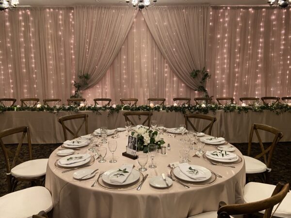 A round table with plates and silverware on it.