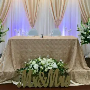 A couple of tables with flowers on top