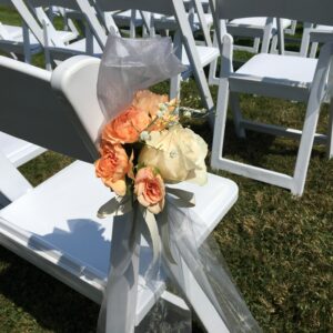A white chair with flowers on it