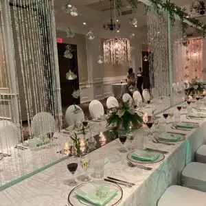 A long table with many plates and silverware.