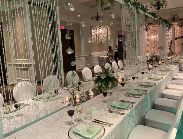 A long table with many plates and silverware.