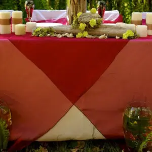 A table with candles and flowers on it