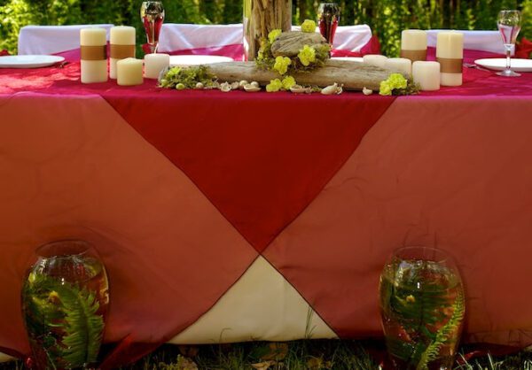 A table with candles and flowers on it