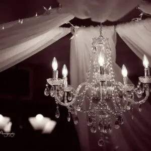 A chandelier with lights hanging from the ceiling.