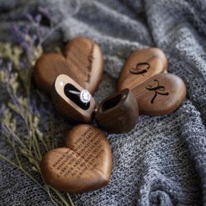 A group of wooden hearts with initials on them.