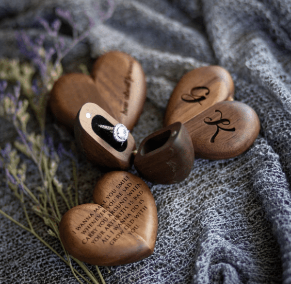 A group of wooden hearts with initials on them.