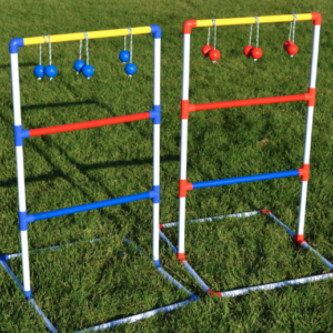 A pair of ladder golf game in the grass.