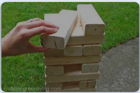 A person playing with blocks on the ground