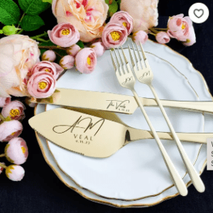 A plate with forks, knives and flowers on it.