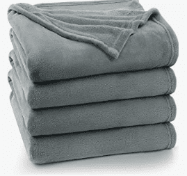 A stack of four blankets folded in one pile.