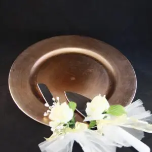 A plate with flowers and utensils on top of it.