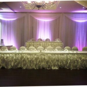 A long table with many chairs in front of it