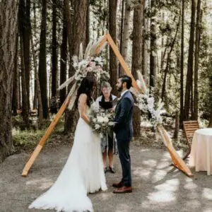 A couple getting married in the woods