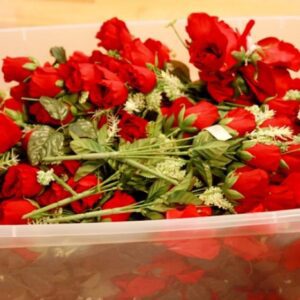 red flowers by the bin