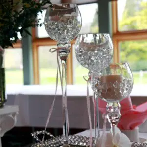 A table with three wine glasses on it