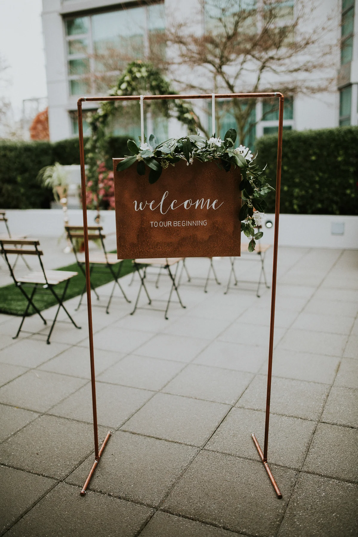 A sign that says welcome to the wedding.