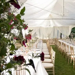 A large tent with many tables and chairs