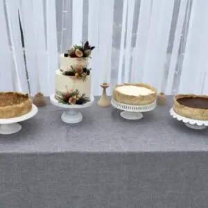 A table with four different cakes on it