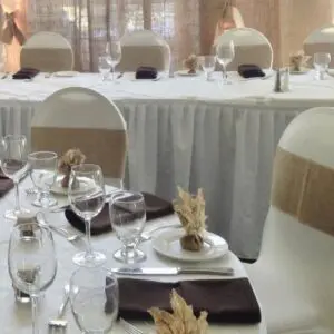 A table set with white and brown napkins.